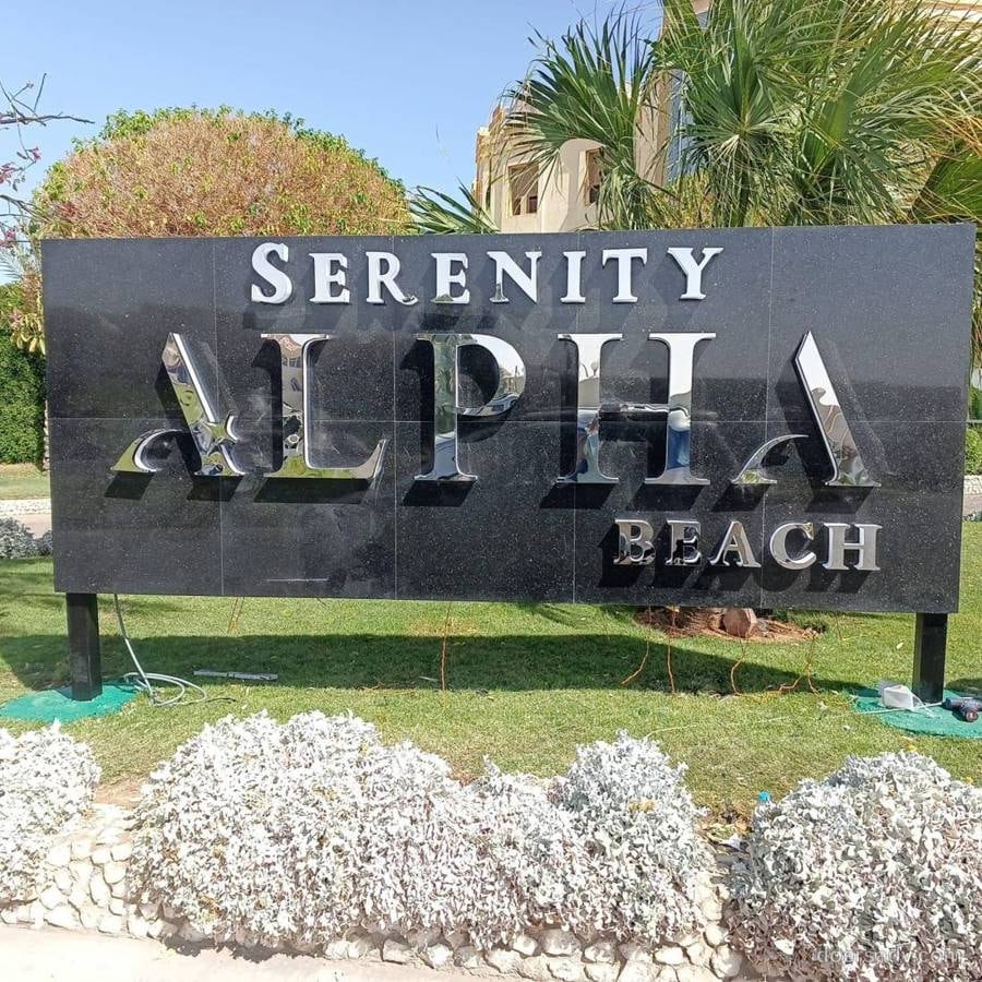 Serenity Alpha Beach · Resort entrance sign